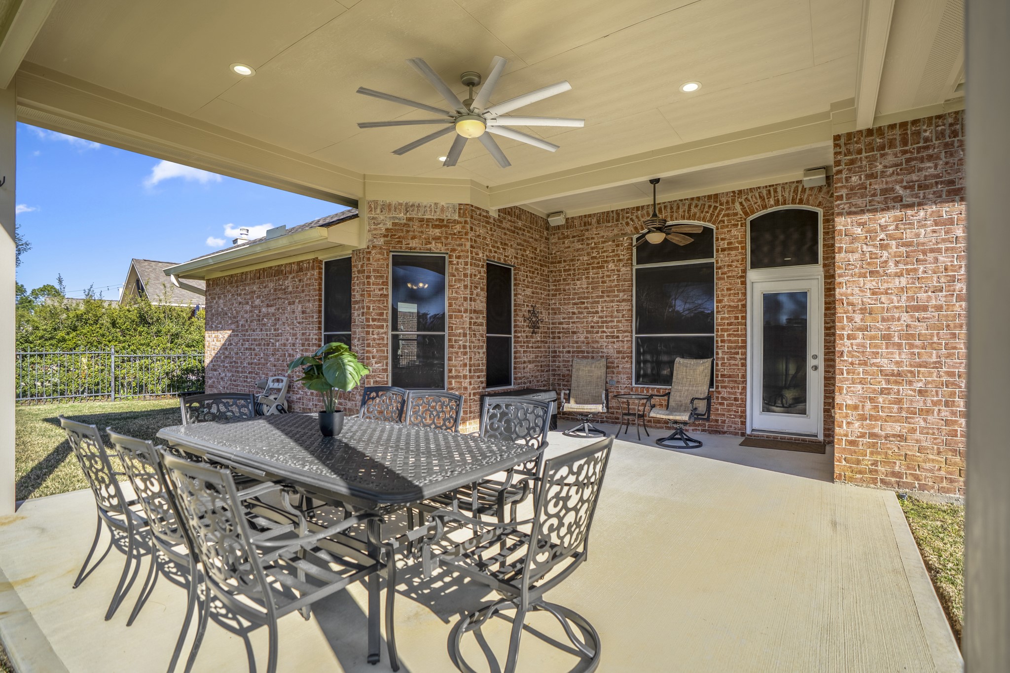 6218 Stone Trail Lane Spring, TX 77379 - Photo 28 of 50 Designed for easy outdoor living, this space comfortably fits a full dining setup—perfect for lingering meals, casual get-togethers, and taking in the golf course scenery beyond.