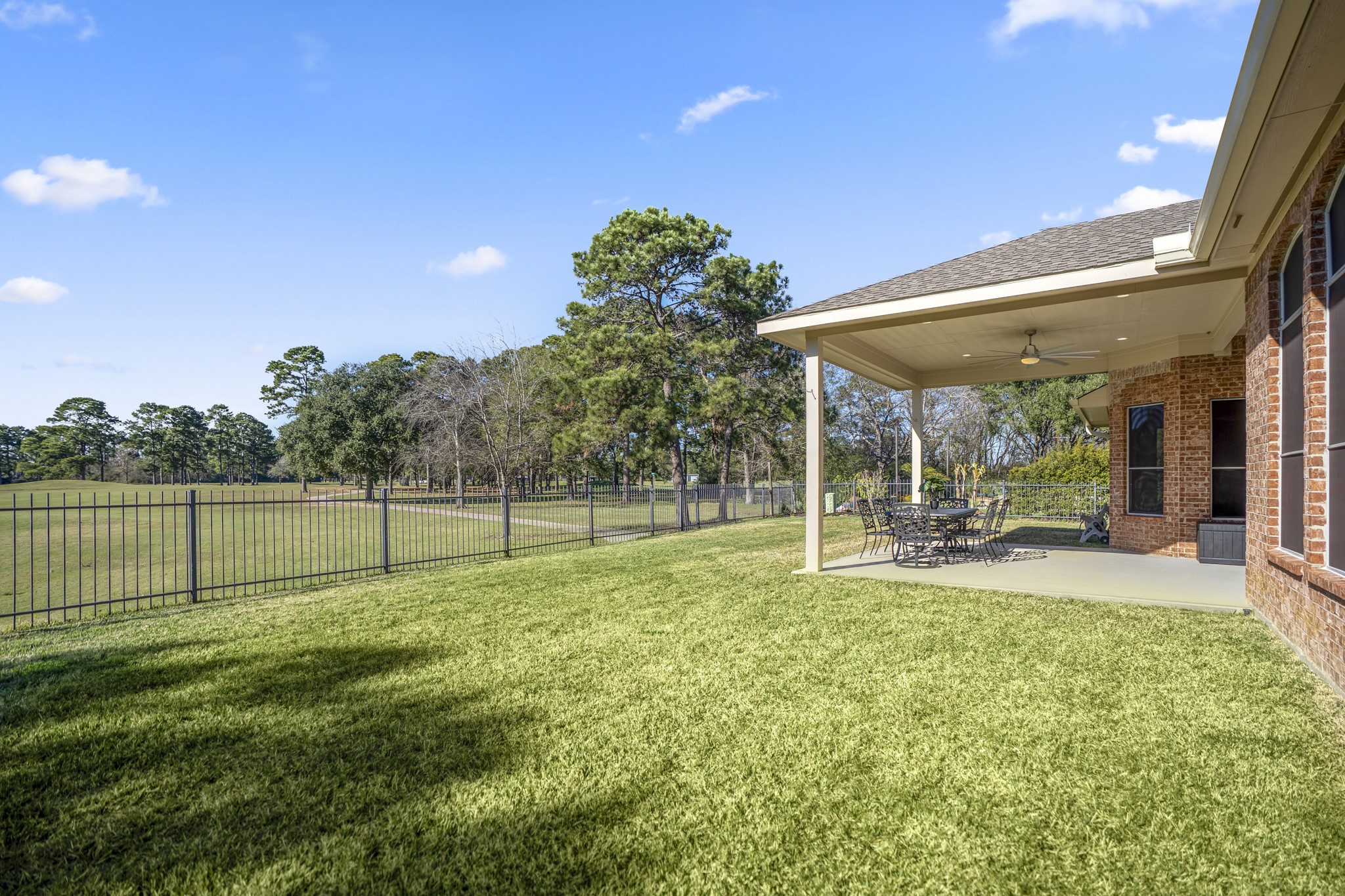 6218 Stone Trail Lane Spring, TX 77379 - Photo 31 of 50 Wide-open views, soft breezes, and the quiet rhythm of the course beyond the fence set the tone for relaxed outdoor living.