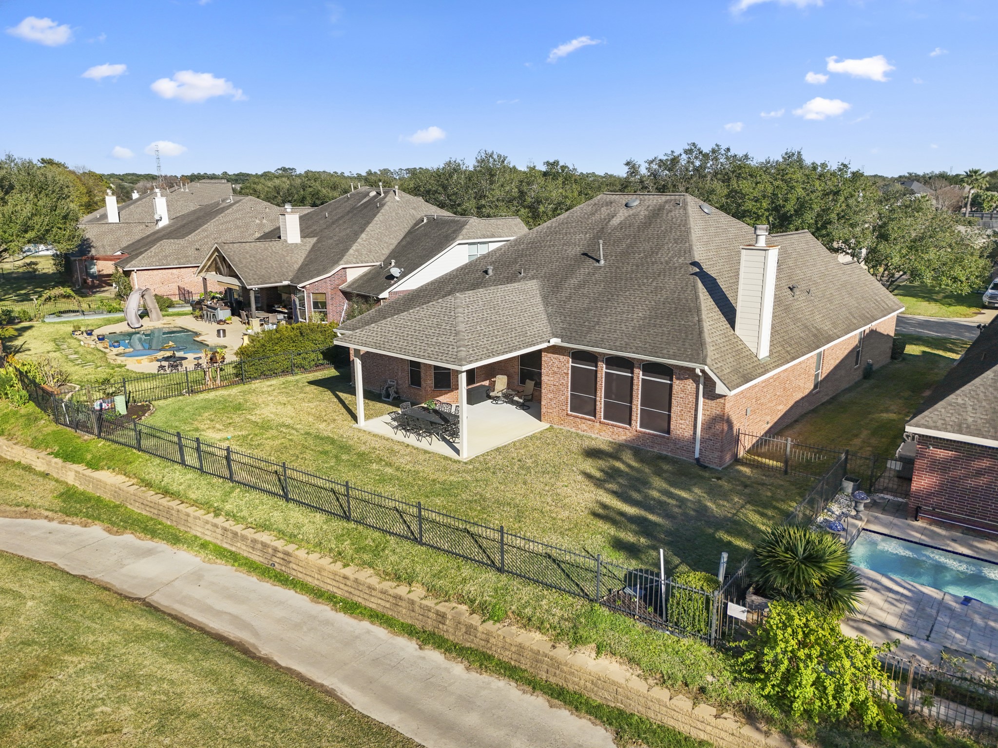 6218 Stone Trail Lane Spring, TX 77379 - Photo 34 of 50 From above, you can see how naturally the home sits along the golf course—backing to open greens that bring peaceful views, visiting birds, and unforgettable sunsets right to the backyard.