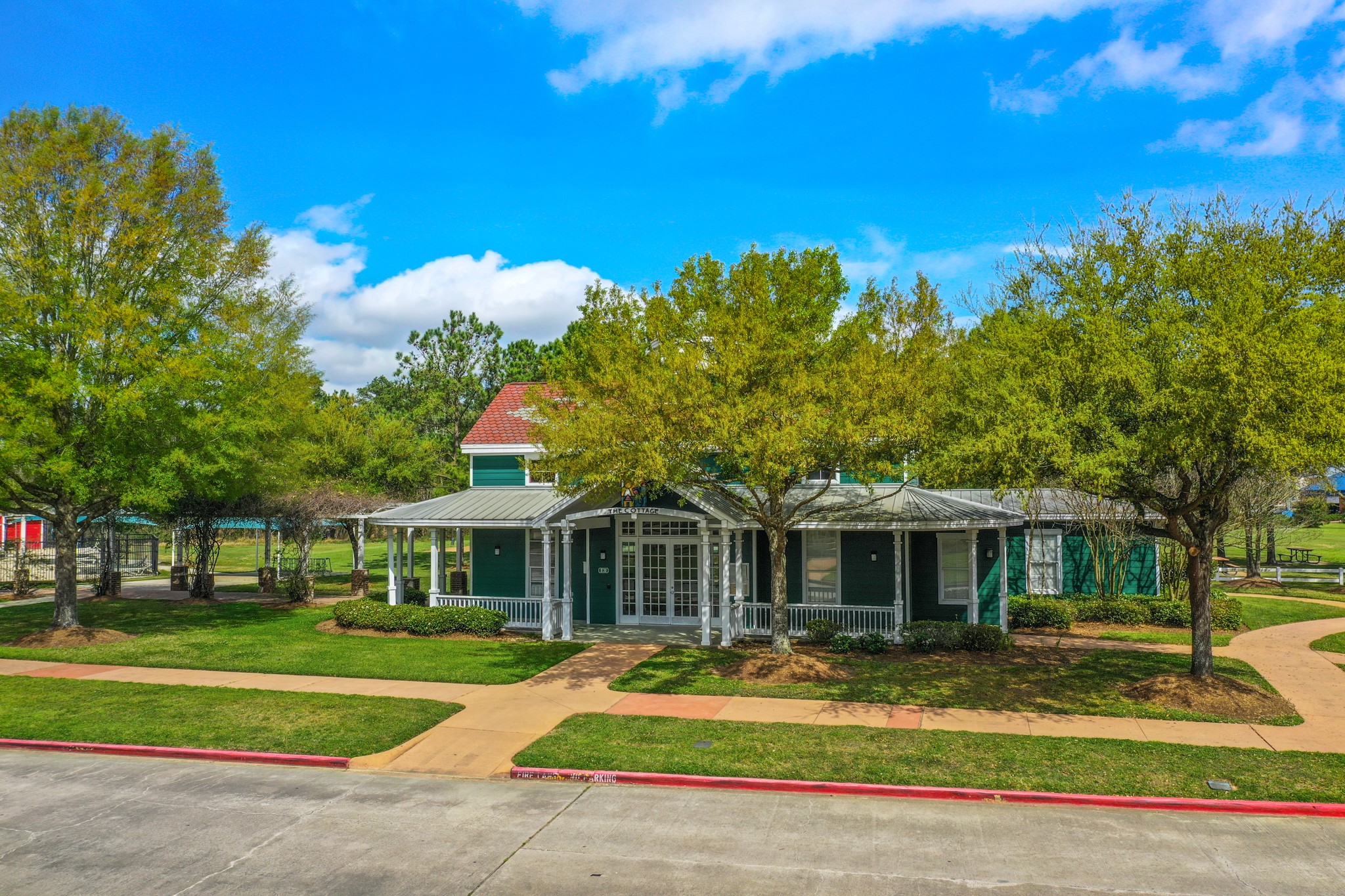 6218 Stone Trail Lane Spring, TX 77379 - Photo 42 of 50 Windrose boasts beautifully designed clubhouse surrounded by lush courtyards, inviting benches, and scenic walking trails. A perfect setting for gatherings!