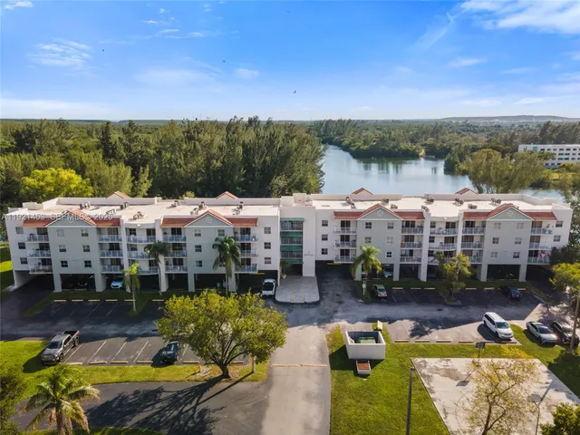 an aerial view of a house with a swimming pool