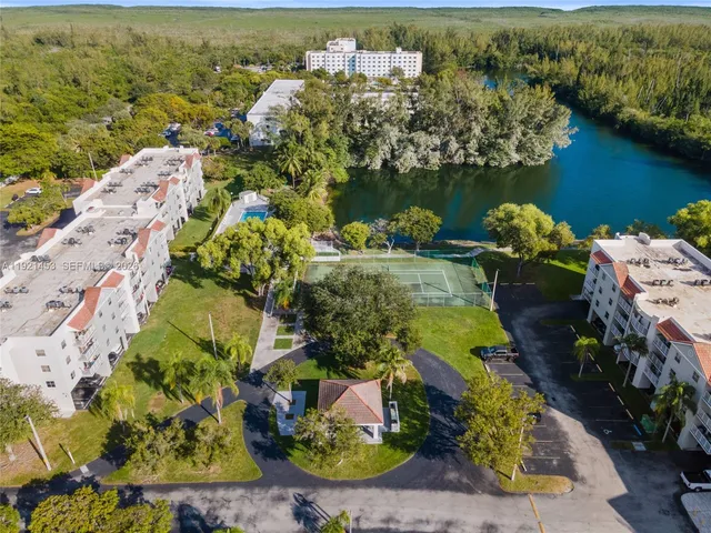 an aerial view of a house with a lake view