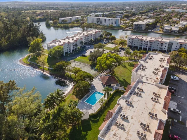 an aerial view of a house with a lake view