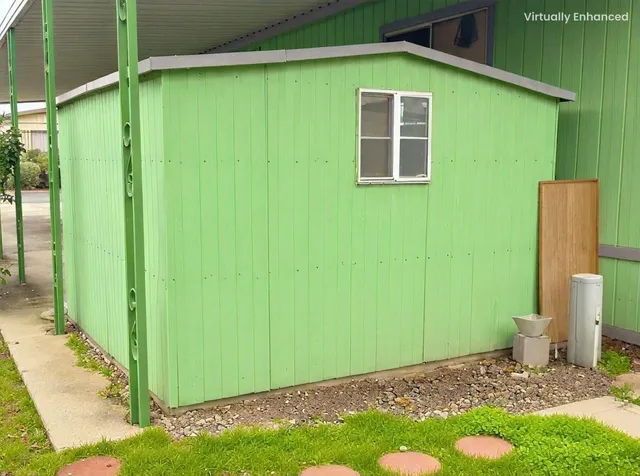a view of a house with a small yard