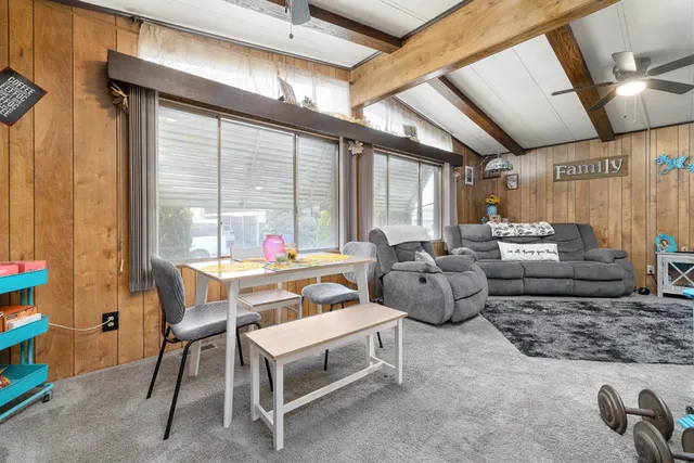 a kitchen with stainless steel appliances kitchen island granite countertop a stove a sink and a microwave