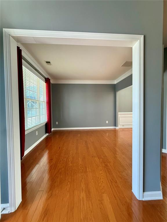 1009 South Creek Drive Villa Rica, GA 30180 - Photo 11 of 61 a view of an empty room with wooden floor and a window