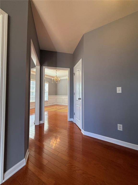 1009 South Creek Drive Villa Rica, GA 30180 - Photo 12 of 61 a view of an empty room with wooden floor and a window