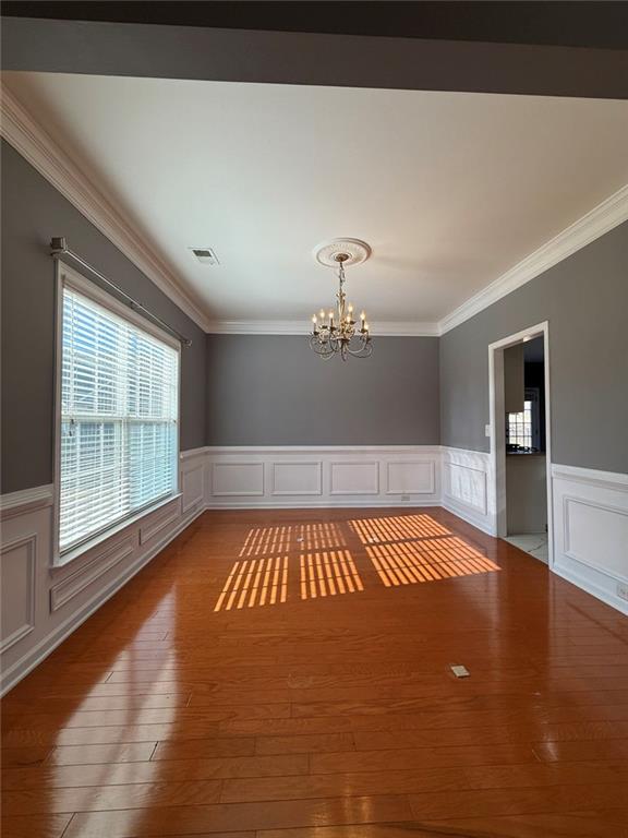 1009 South Creek Drive Villa Rica, GA 30180 - Photo 15 of 61 a view of an empty room with wooden floor and a window
