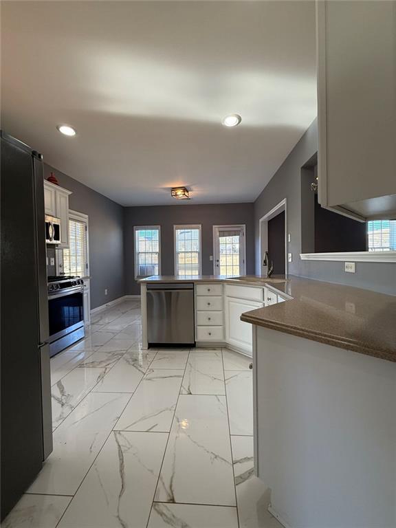 1009 South Creek Drive Villa Rica, GA 30180 - Photo 20 of 61 a kitchen with stainless steel appliances granite countertop a sink and cabinets