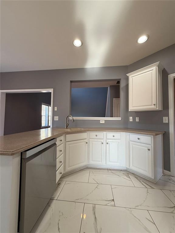 1009 South Creek Drive Villa Rica, GA 30180 - Photo 25 of 61 a kitchen with a sink and cabinets