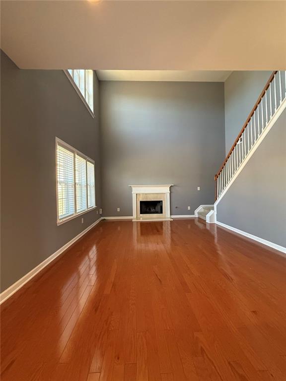 1009 South Creek Drive Villa Rica, GA 30180 - Photo 28 of 61 a view of an empty room with a window and wooden floor