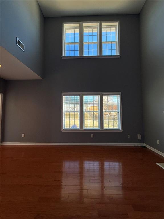 1009 South Creek Drive Villa Rica, GA 30180 - Photo 32 of 61 a view of an empty room with wooden floor and a window