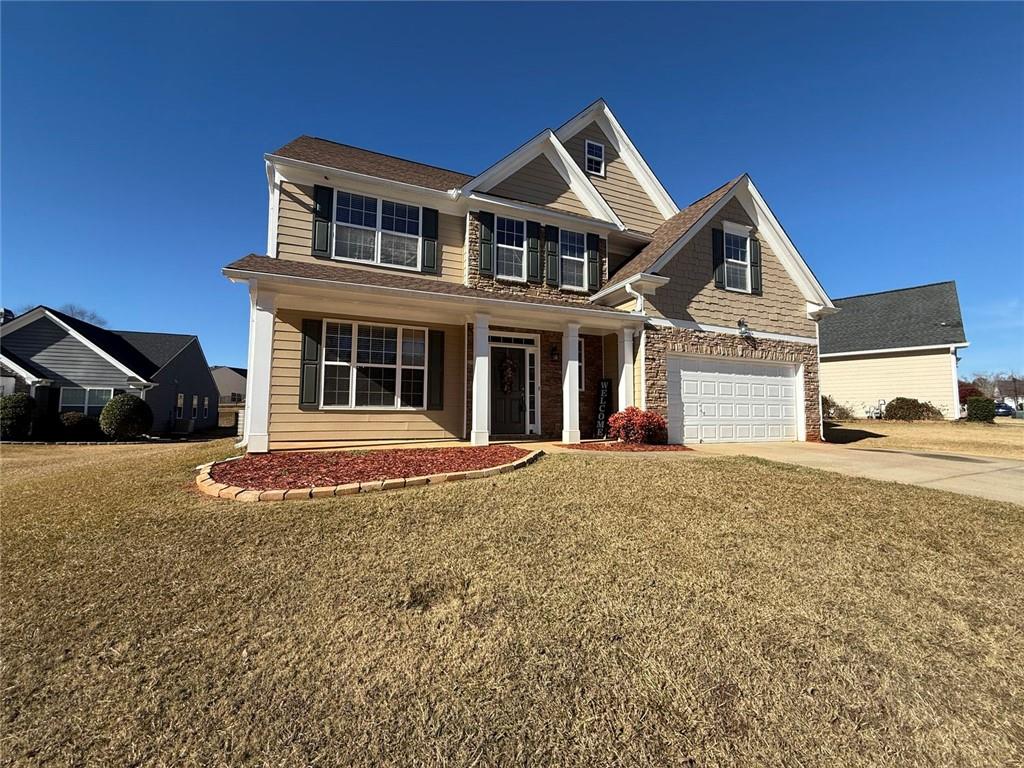 1009 South Creek Drive Villa Rica, GA 30180 - Photo 5 of 61 a front view of a house with a yard