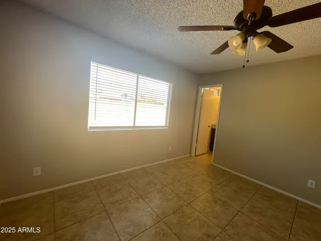 a kitchen with granite countertop stainless steel appliances and wooden cabinets