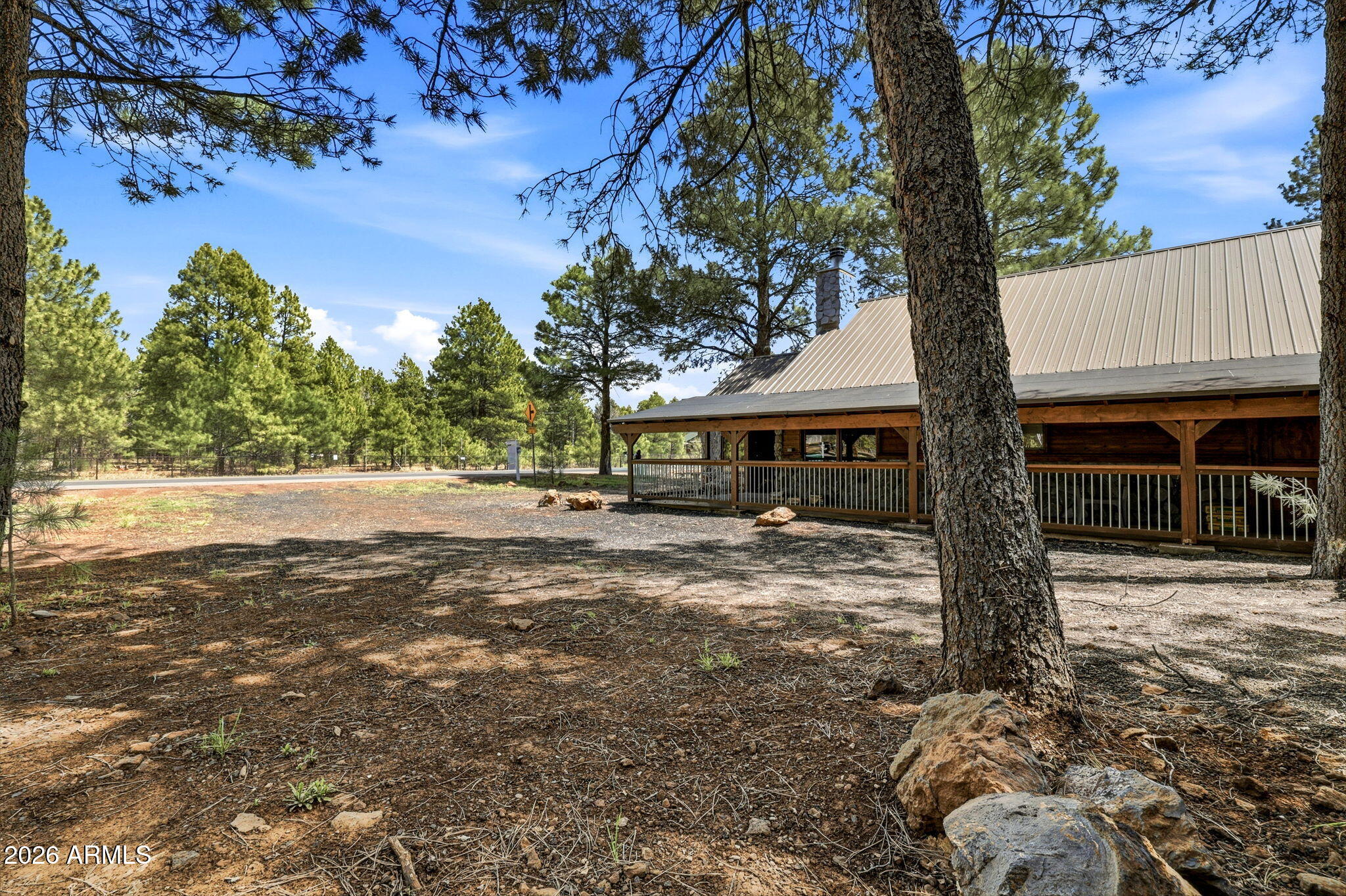 4971 Buck Springs Road Pinetop, AZ 85935 - Photo 27 of 32 a front view of a house with a yard