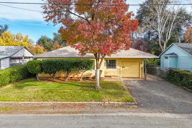 front view of a house with a yard