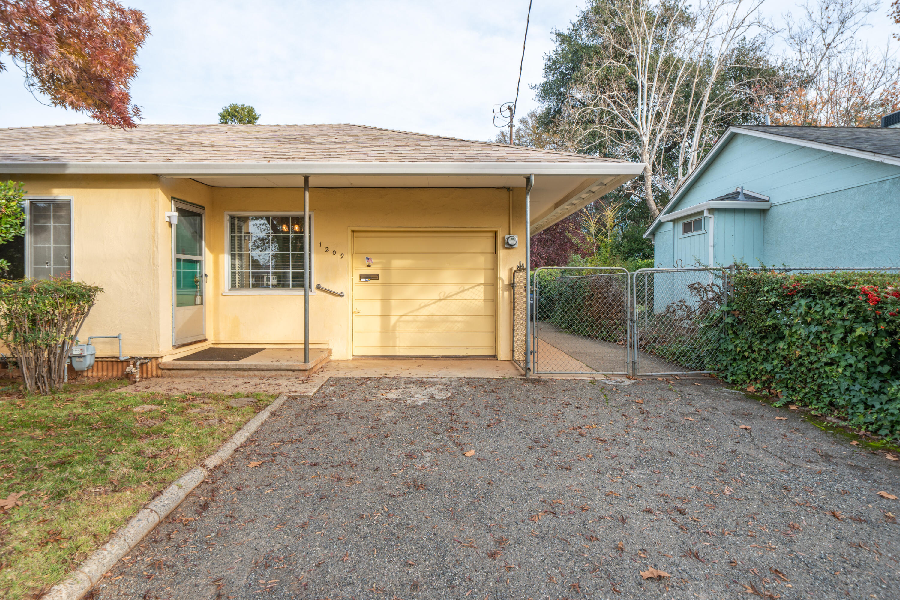 1209 C Street Redding, CA 96002 - Photo 42 of 48 a front view of a house with garden
