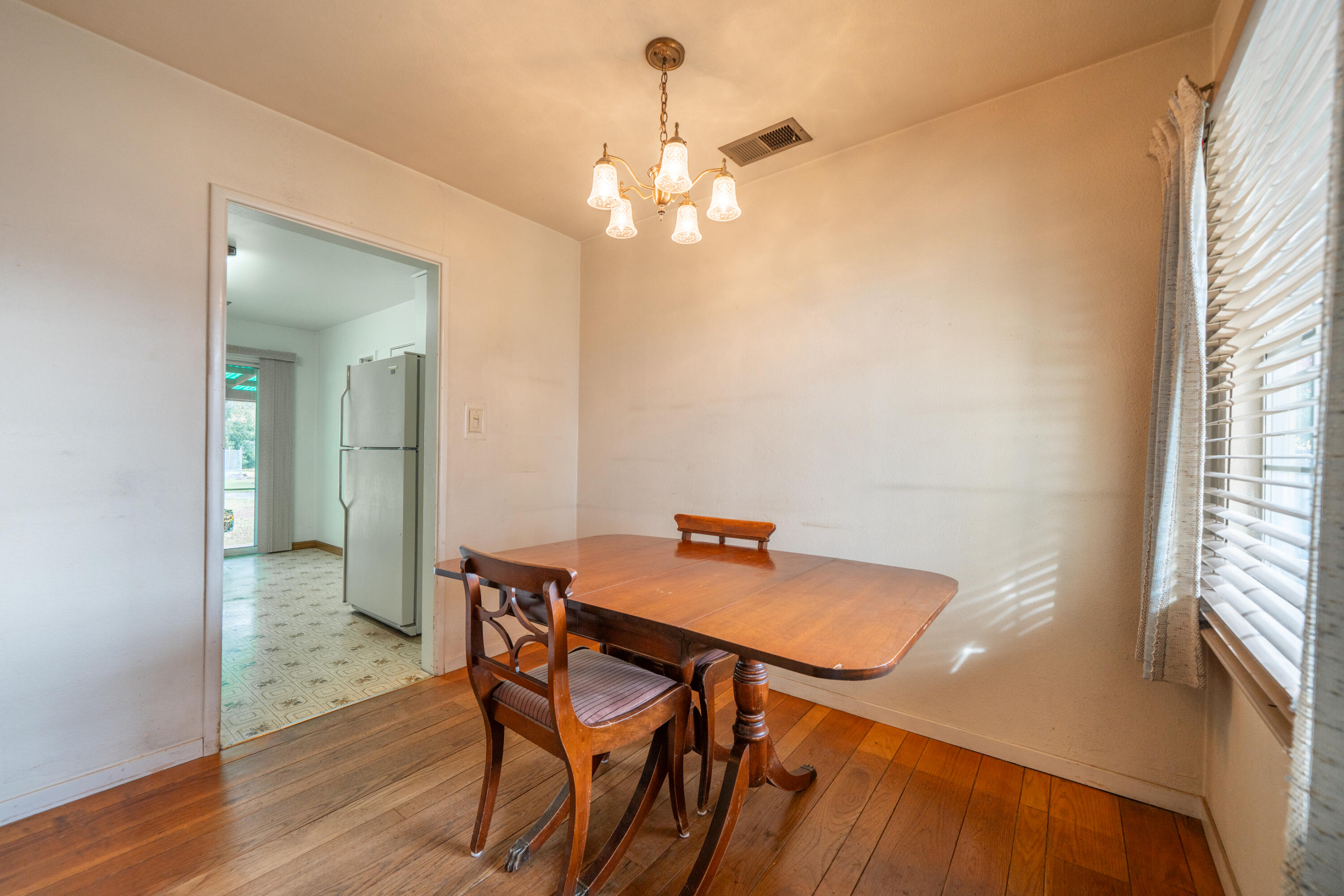 1209 C Street Redding, CA 96002 - Photo 9 of 48 a view of a dining room with furniture and wooden floor