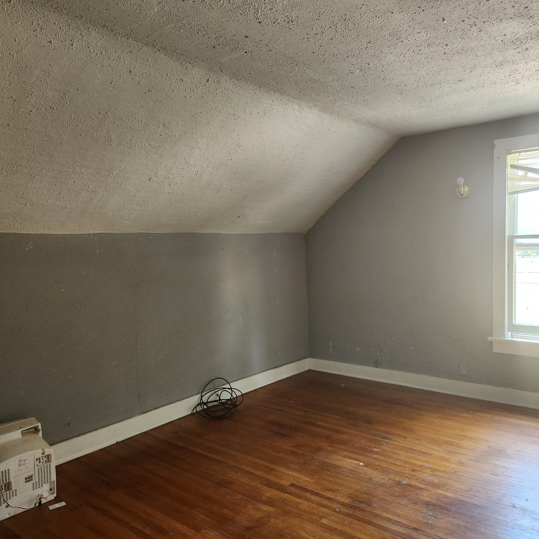 Undisclosed Address Sheldon, IL 60966 - Photo 11 of 24 an empty room with wooden floor and windows