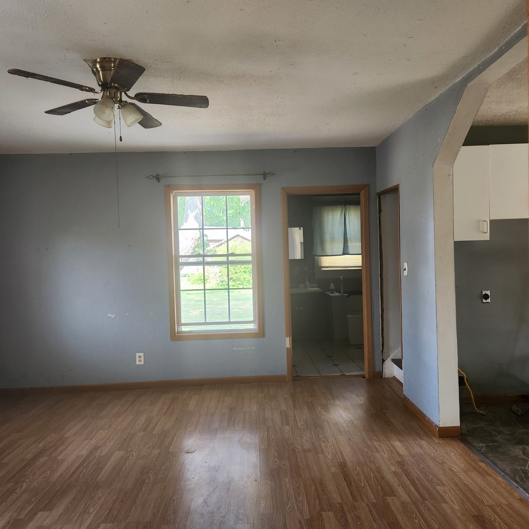 Undisclosed Address Sheldon, IL 60966 - Photo 16 of 24 an empty room with wooden floor and windows