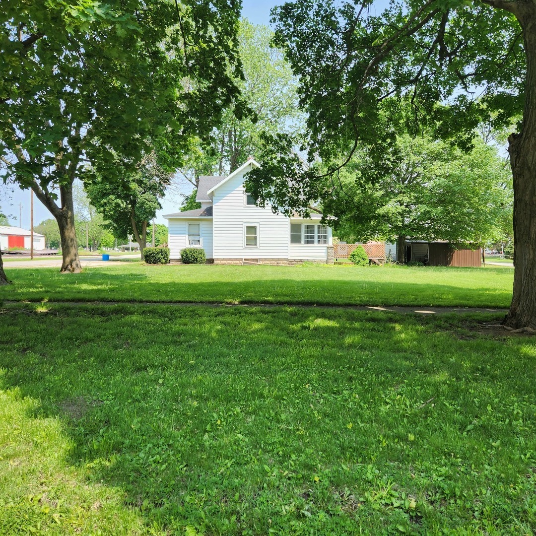 Undisclosed Address Sheldon, IL 60966 - Photo 2 of 24 a front view of a house with a yard