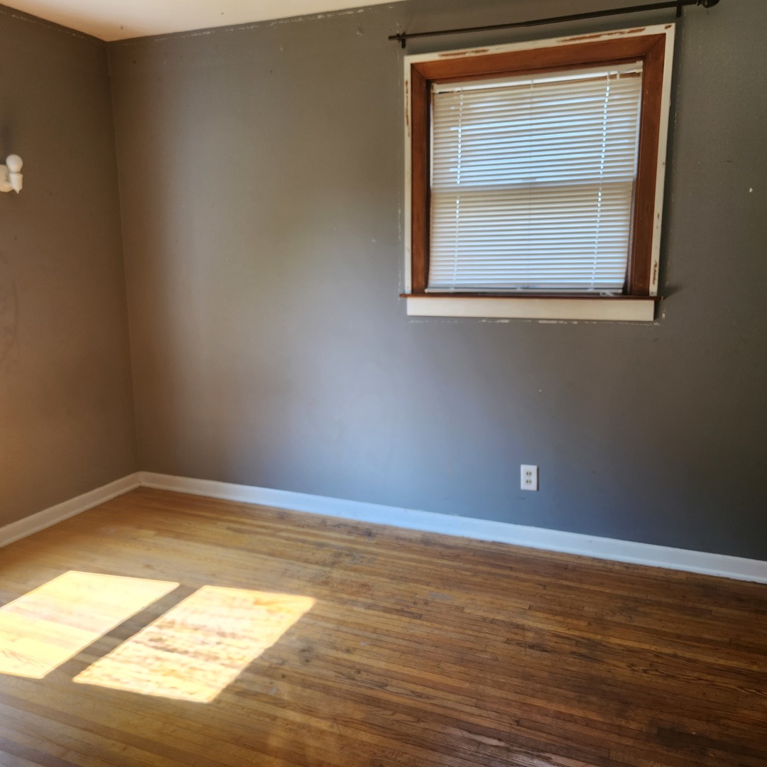 Undisclosed Address Sheldon, IL 60966 - Photo 21 of 24 a view of an empty room with wooden floor and a window