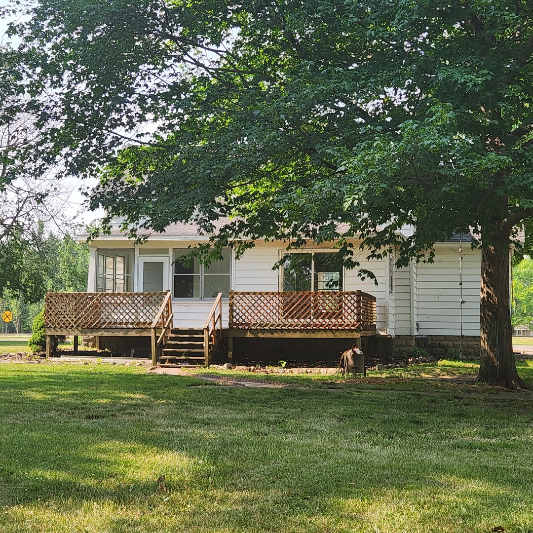 Undisclosed Address Sheldon, IL 60966 - Photo 6 of 24 a front view of a house with a garden