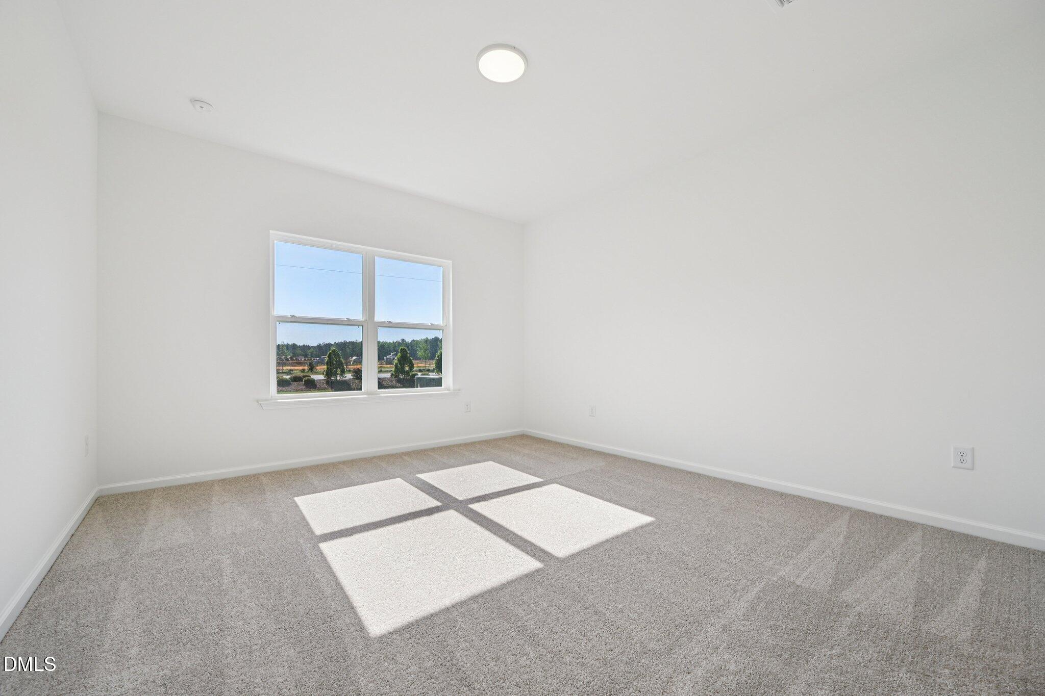 142 North Harvest Rdg Way, Unit HOMESITE 310 Clayton, NC 27520 - Photo 18 of 43 an empty room with a window