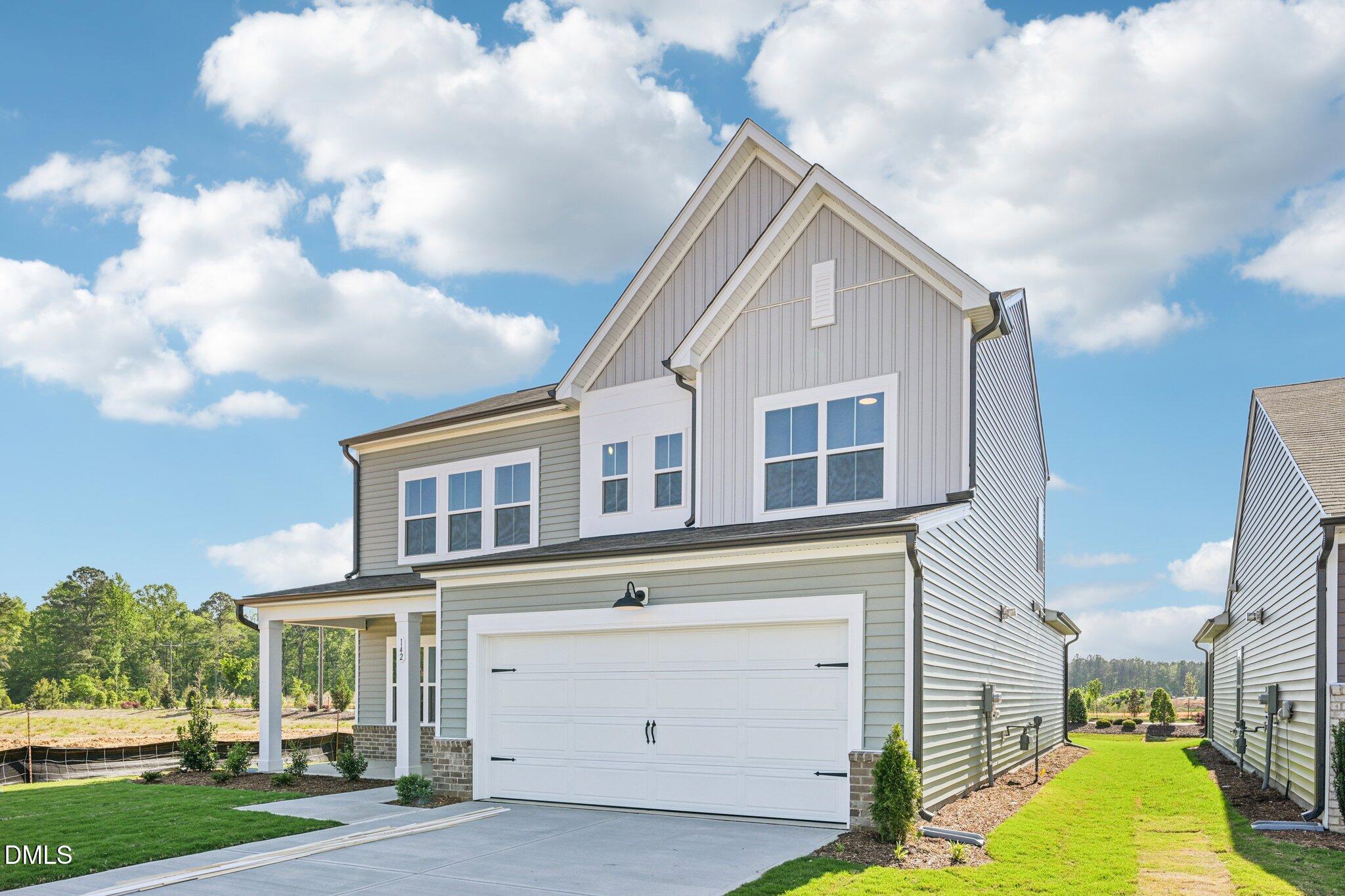142 North Harvest Rdg Way, Unit HOMESITE 310 Clayton, NC 27520 - Photo 2 of 43 a view of a house with a yard