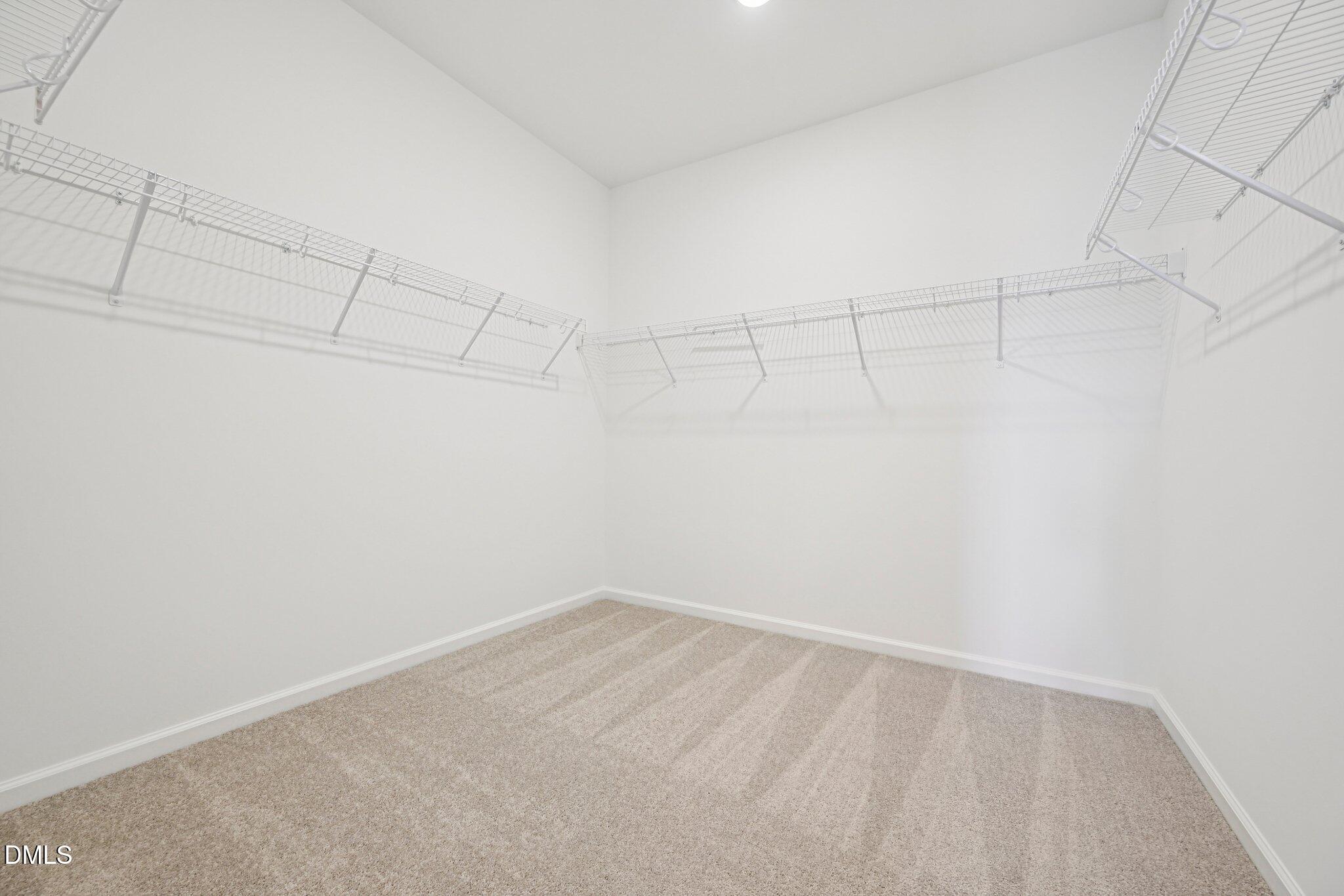 142 North Harvest Rdg Way, Unit HOMESITE 310 Clayton, NC 27520 - Photo 21 of 43 a view of a room with racks on the wall