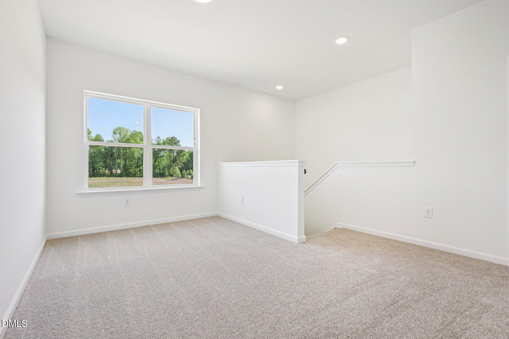 142 North Harvest Rdg Way, Unit HOMESITE 310 Clayton, NC 27520 - Photo 22 of 43 an empty room with a window