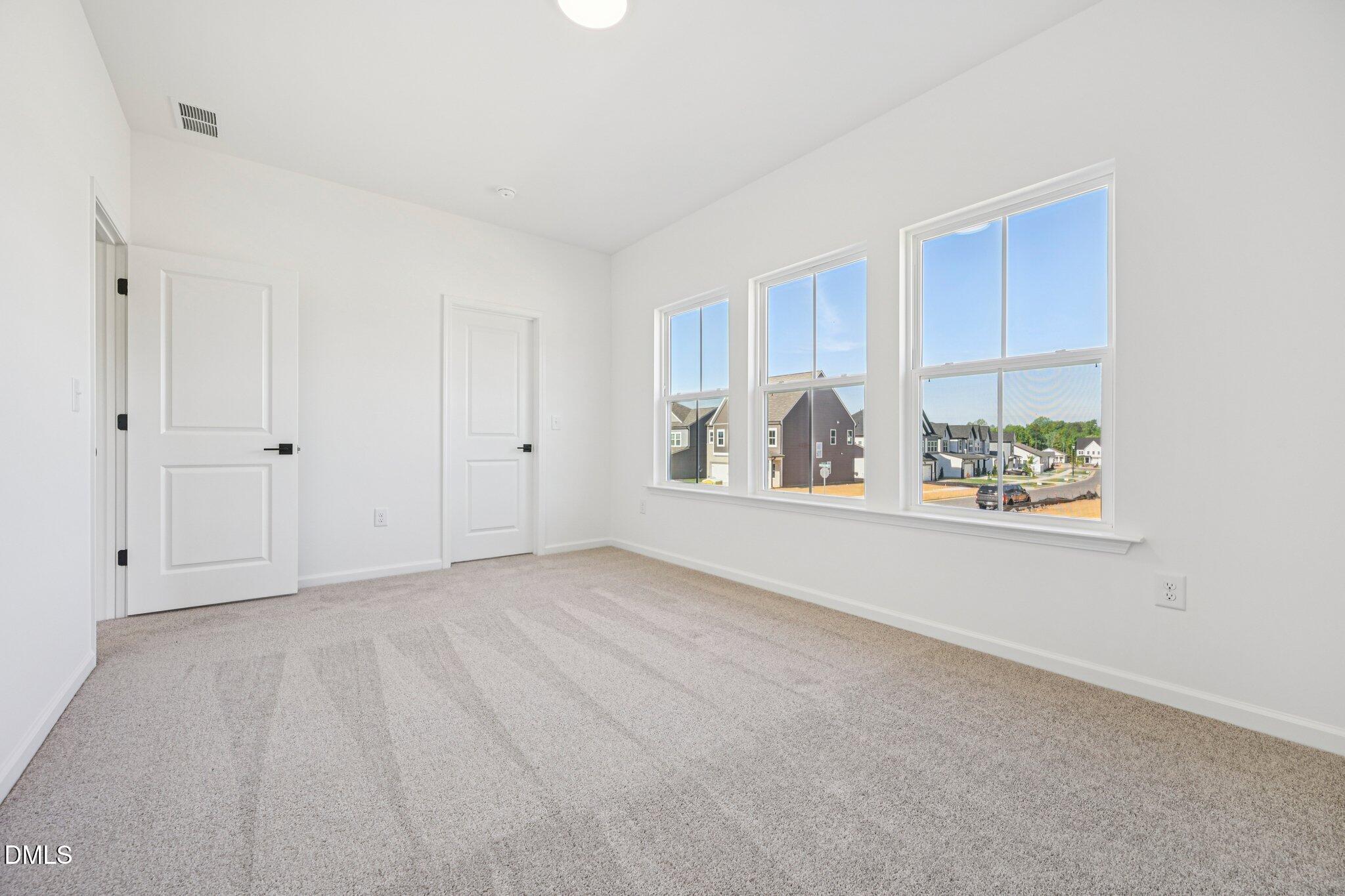 142 North Harvest Rdg Way, Unit HOMESITE 310 Clayton, NC 27520 - Photo 23 of 43 a view of an empty room with a window