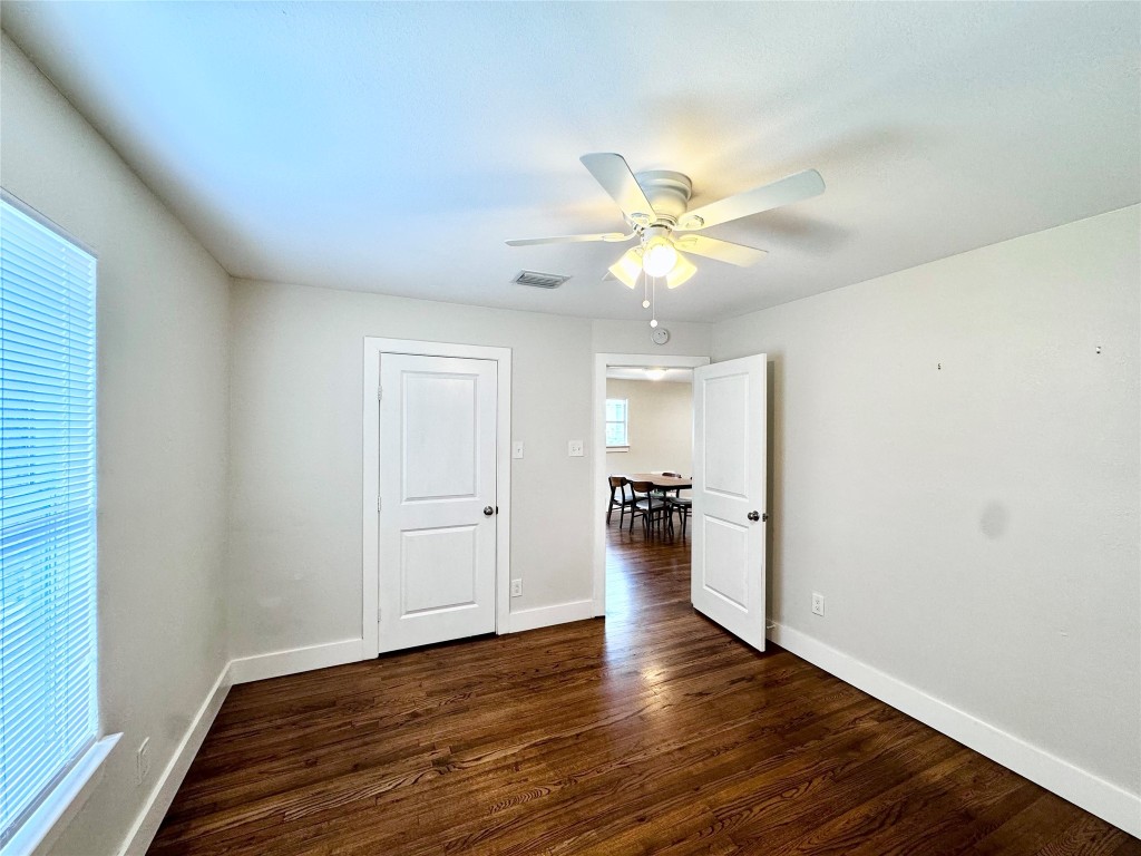 1035 Louise Street Houston, TX 77009 - Photo 12 of 28 wooden floor in an empty room with a window