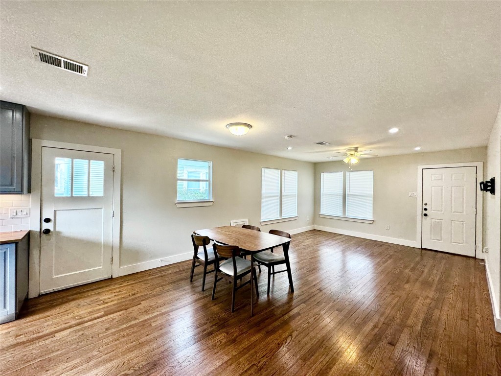 1035 Louise Street Houston, TX 77009 - Photo 6 of 28 a workspace with furniture window and wooden floor