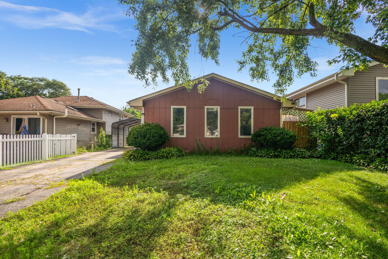 S064 Calvin Court Wheaton, IL 60187 - Photo 1 of 25 a front view of a house with a yard