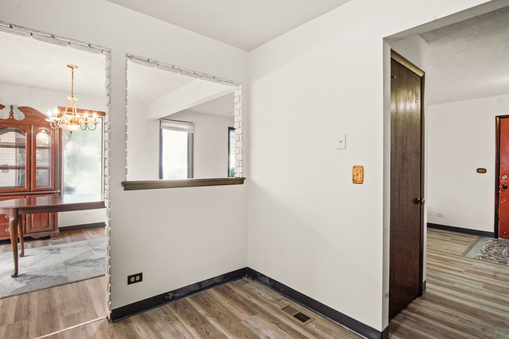 S064 Calvin Court Wheaton, IL 60187 - Photo 12 of 25 a view of hallway with wooden floor