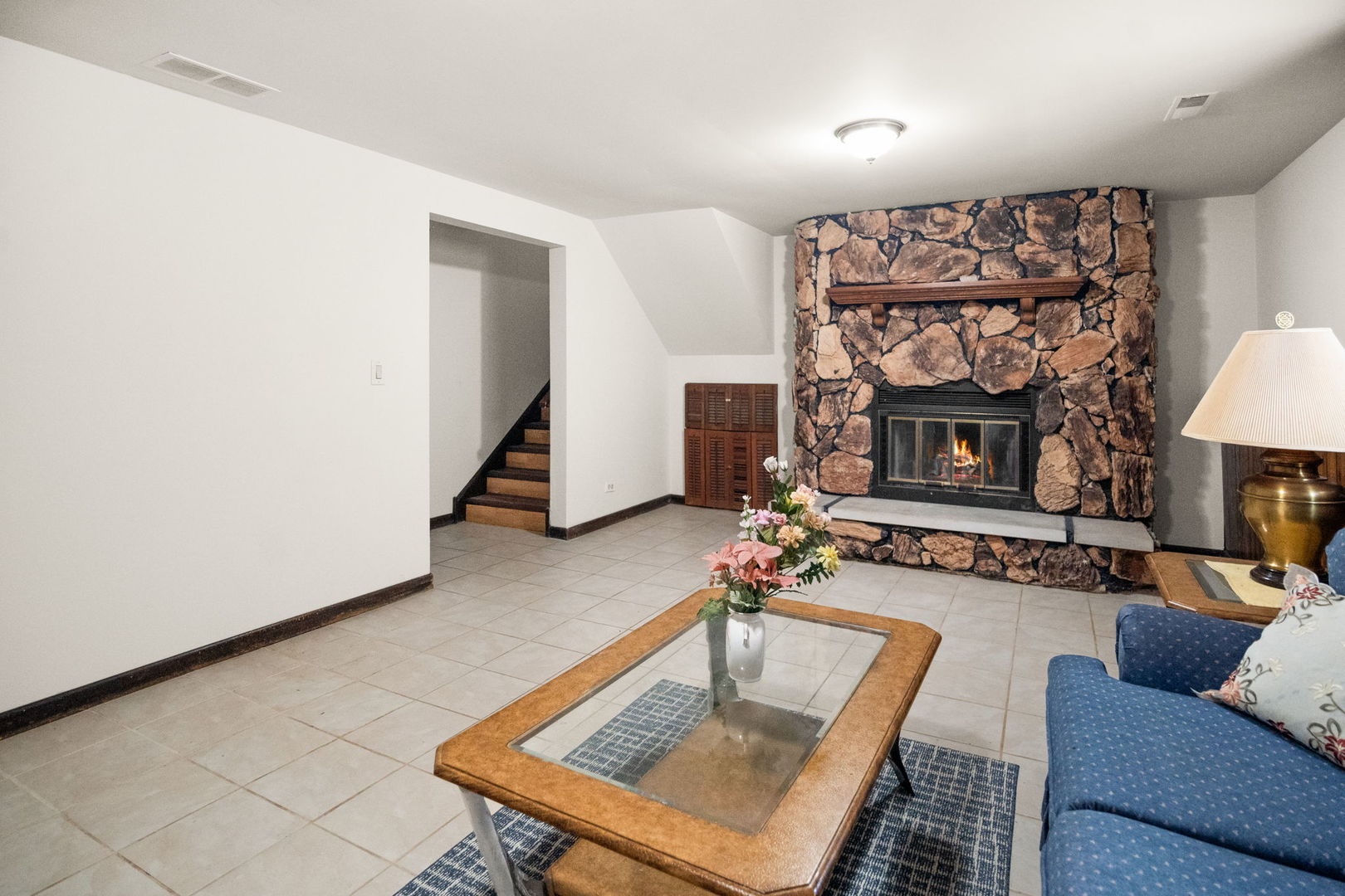 S064 Calvin Court Wheaton, IL 60187 - Photo 18 of 25 a living room with furniture and a fireplace