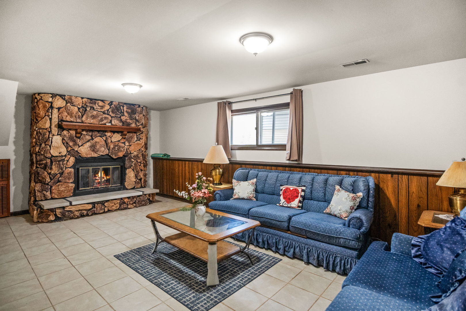 S064 Calvin Court Wheaton, IL 60187 - Photo 19 of 25 a living room with furniture and a fireplace