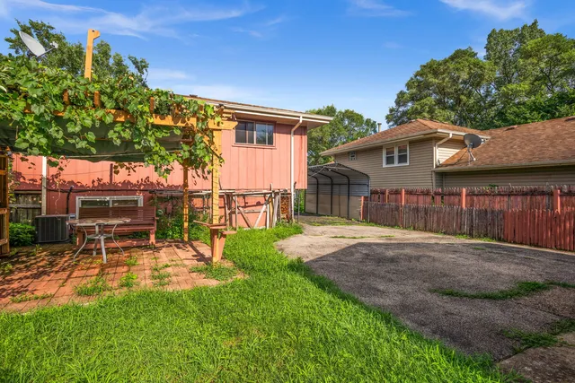 a view of a backyard with a patio
