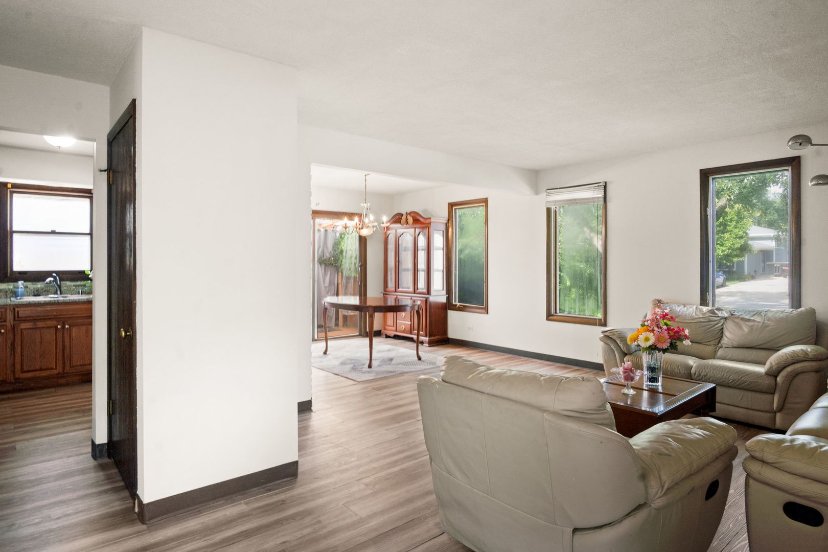 S064 Calvin Court Wheaton, IL 60187 - Photo 4 of 25 a living room with furniture and a large window