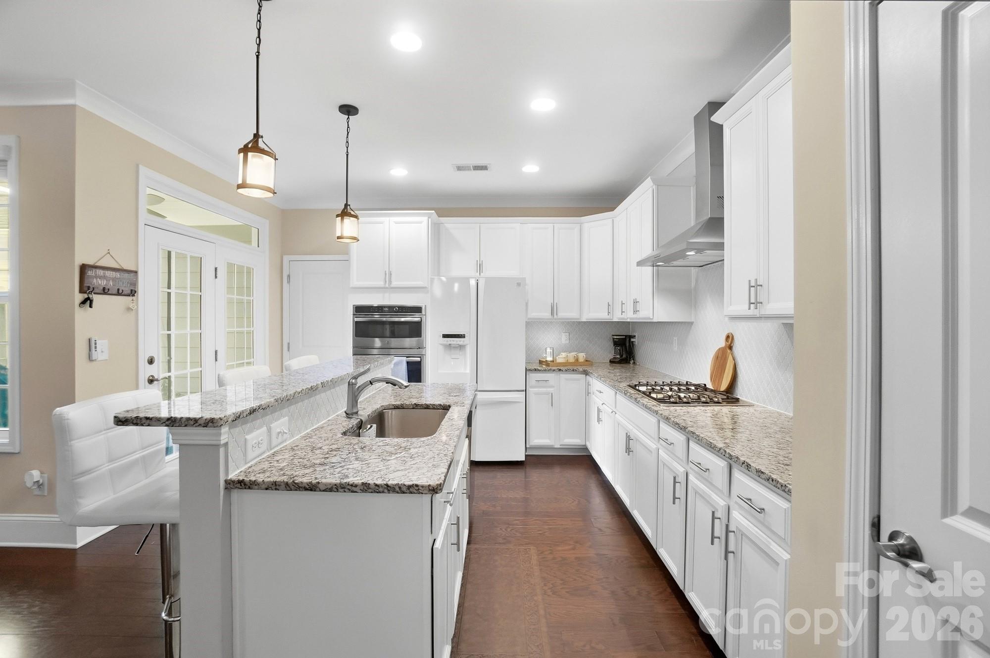 6270 Hove Road Mint Hill, NC 28227 - Photo 13 of 46 a kitchen with stainless steel appliances granite countertop a sink and stove