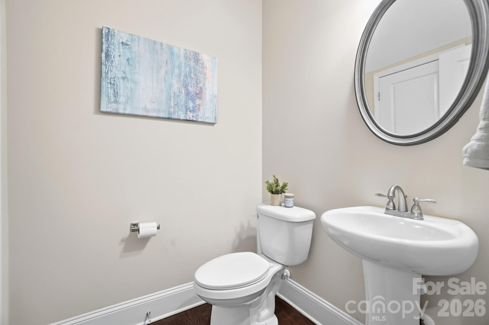 6270 Hove Road Mint Hill, NC 28227 - Photo 19 of 46 a bathroom with a toilet and a sink