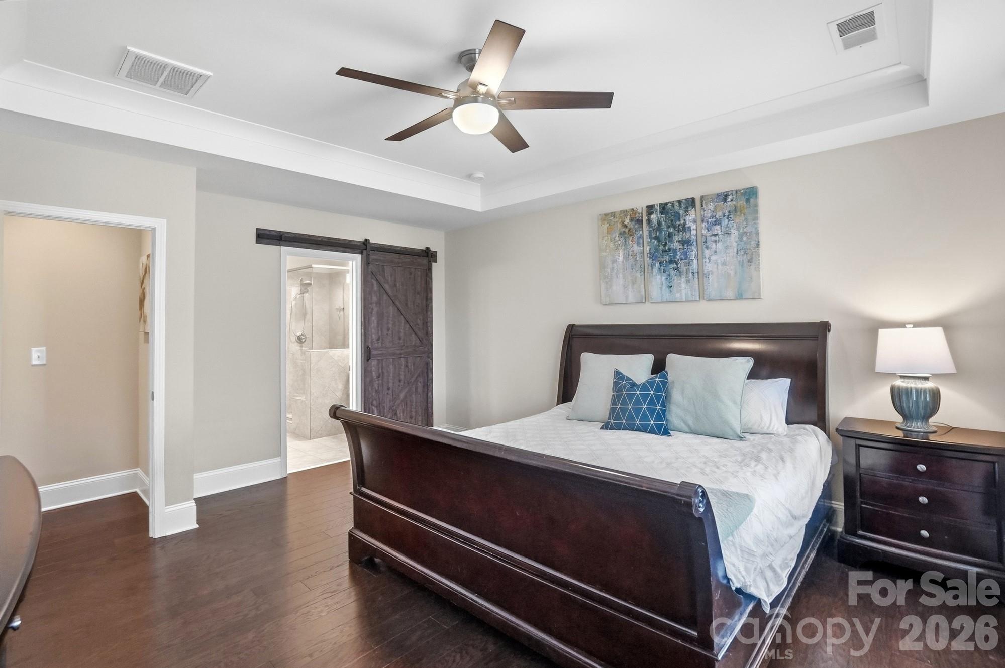 6270 Hove Road Mint Hill, NC 28227 - Photo 21 of 46 a bedroom with a bed and a ceiling fan