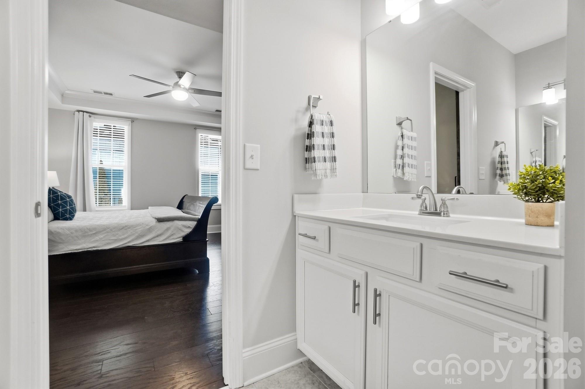 6270 Hove Road Mint Hill, NC 28227 - Photo 25 of 46 a en suite bathroom with sink and mirror