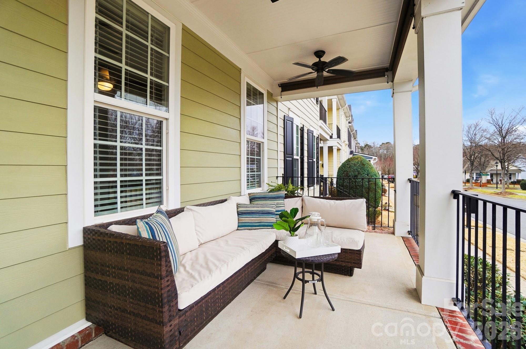 6270 Hove Road Mint Hill, NC 28227 - Photo 3 of 46 a view of a patio with couches and potted plants with wooden floor