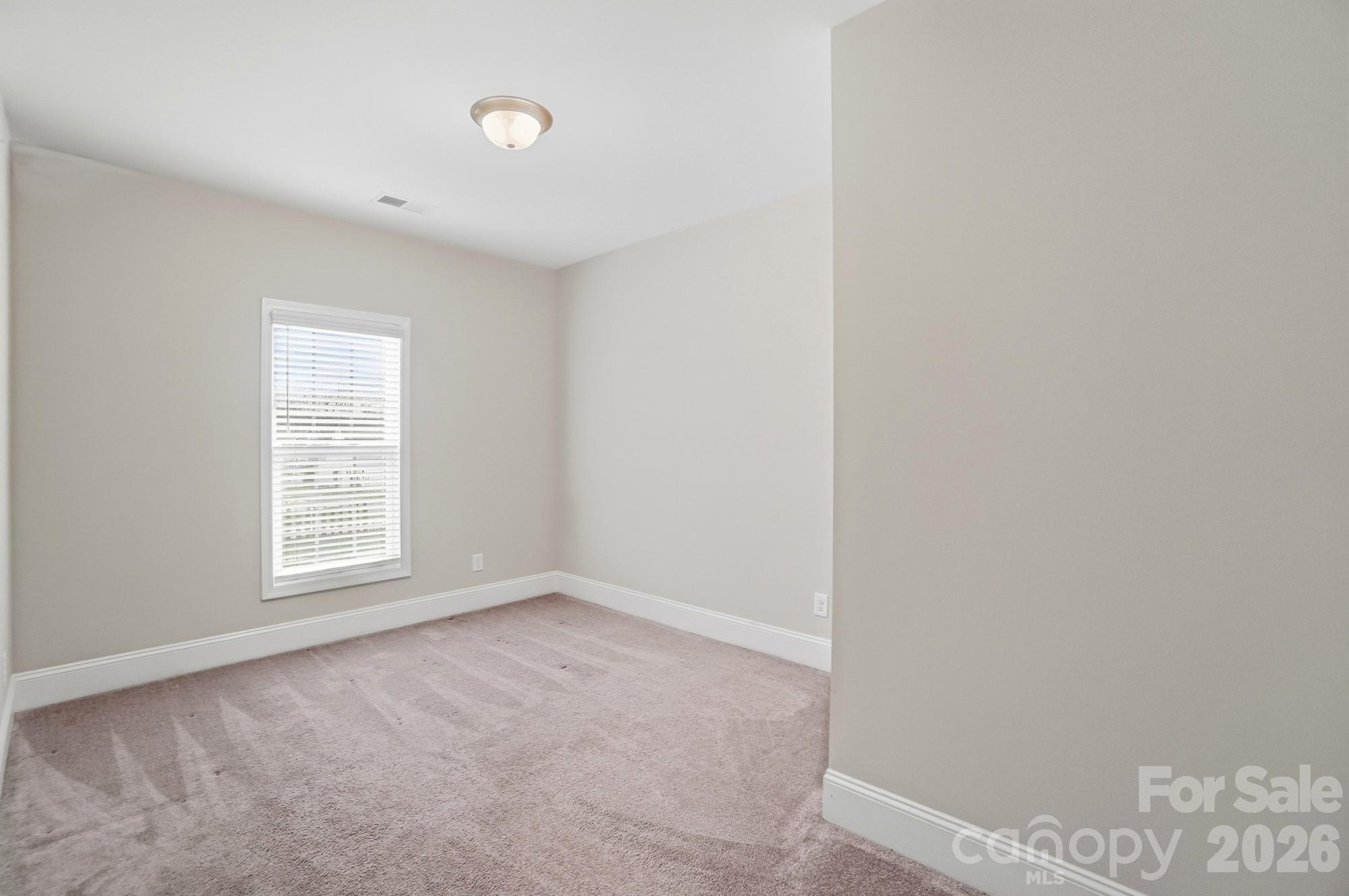 6270 Hove Road Mint Hill, NC 28227 - Photo 36 of 46 a view of an empty room with a window