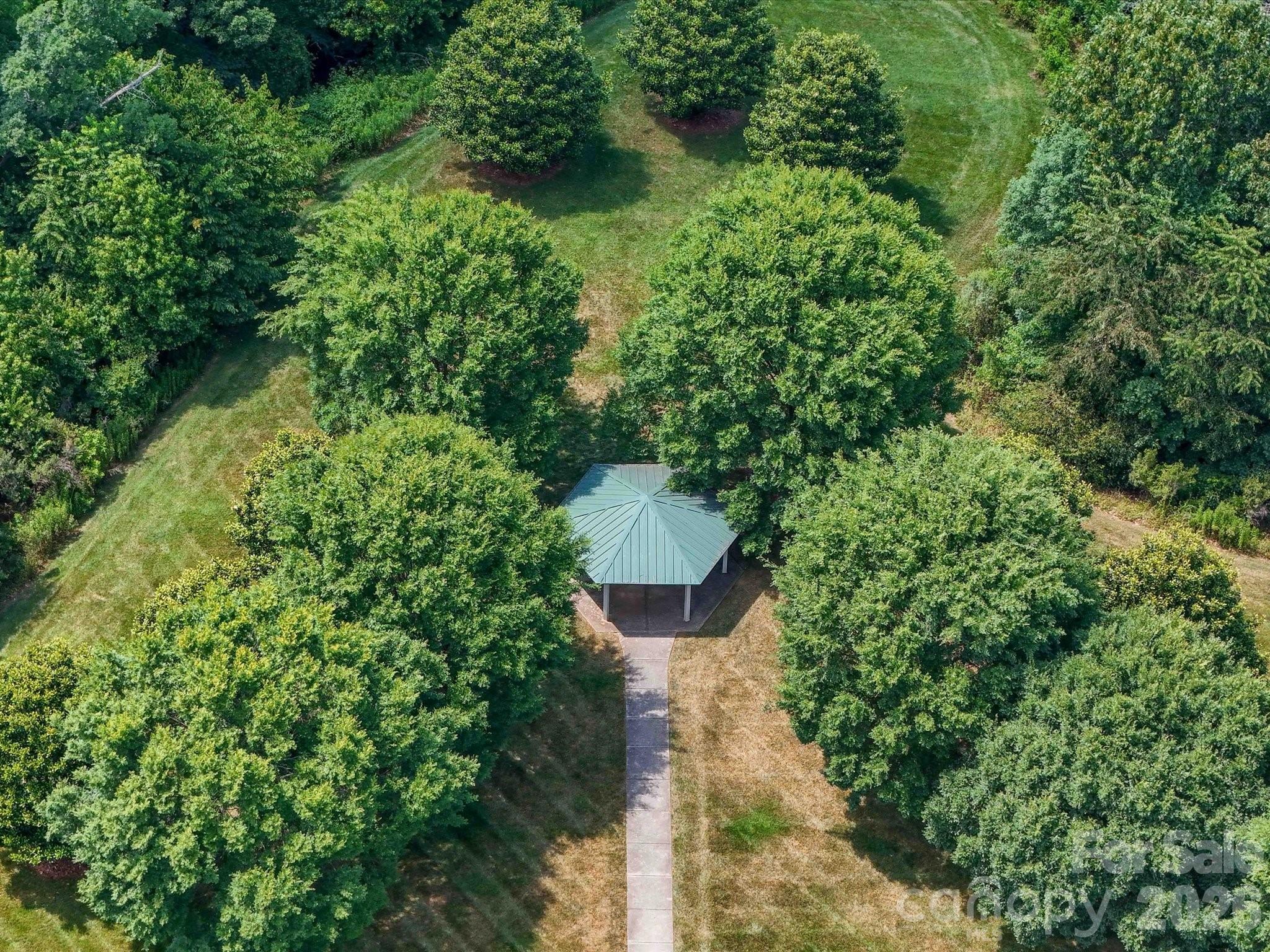 6270 Hove Road Mint Hill, NC 28227 - Photo 45 of 46 a view of a garden with a fountain