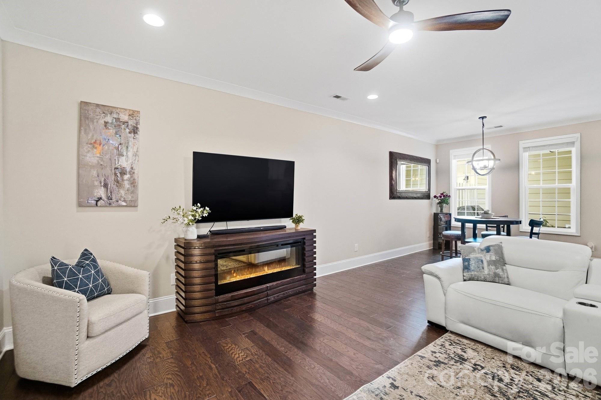6270 Hove Road Mint Hill, NC 28227 - Photo 5 of 46 a living room with furniture and a flat screen tv
