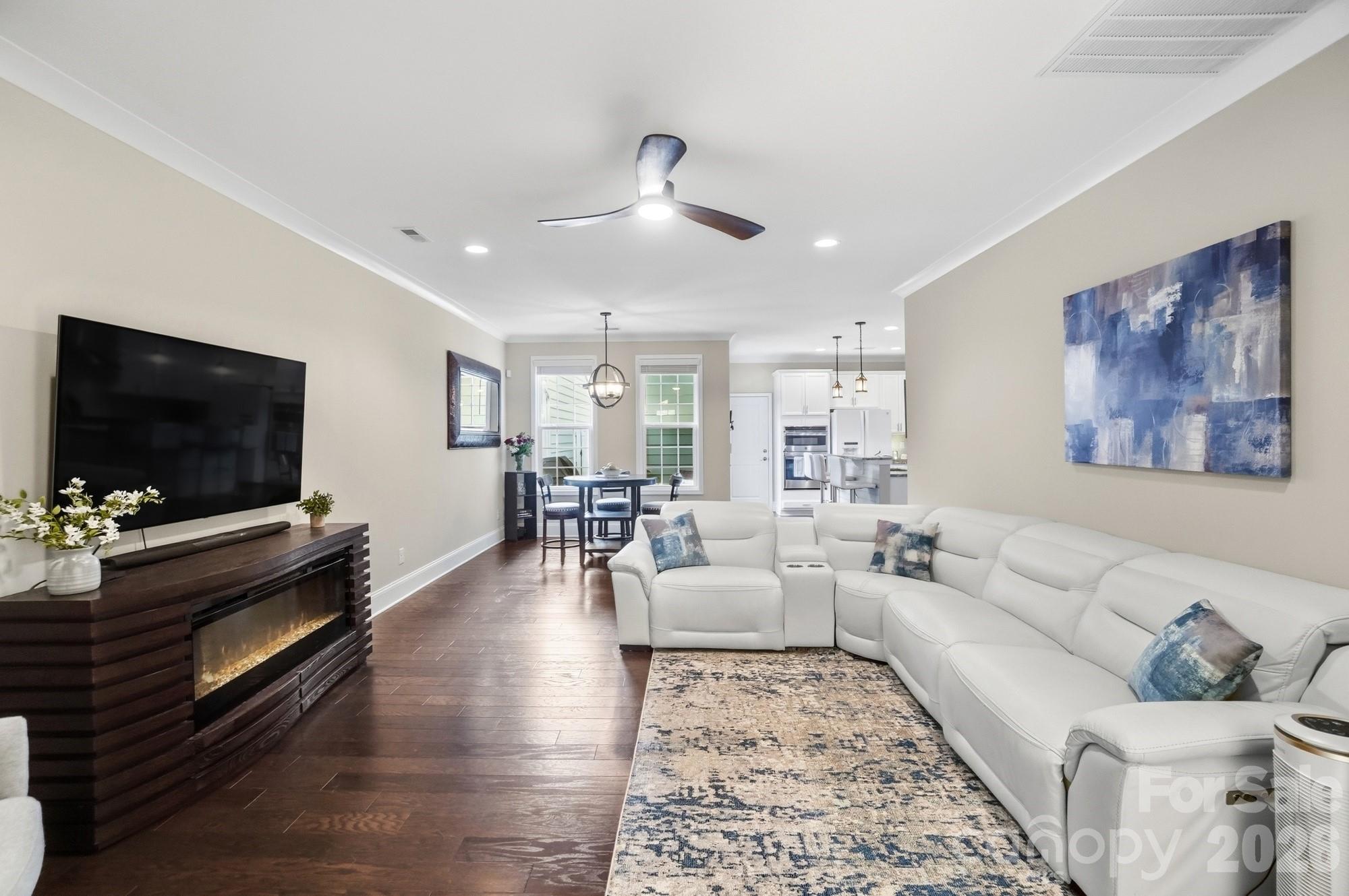 6270 Hove Road Mint Hill, NC 28227 - Photo 6 of 46 a living room with furniture and a flat screen tv