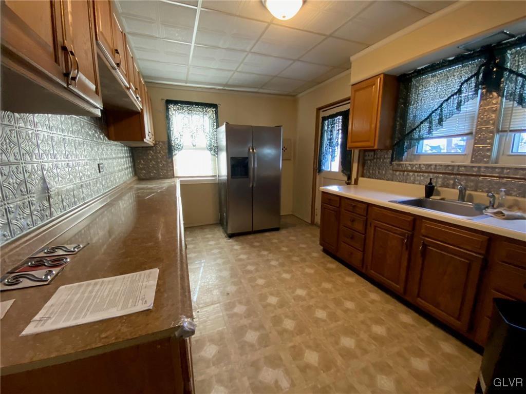 282 13th Avenue Bethlehem, PA 18018 - Photo 6 of 28 a kitchen with stainless steel appliances granite countertop a sink and a stove